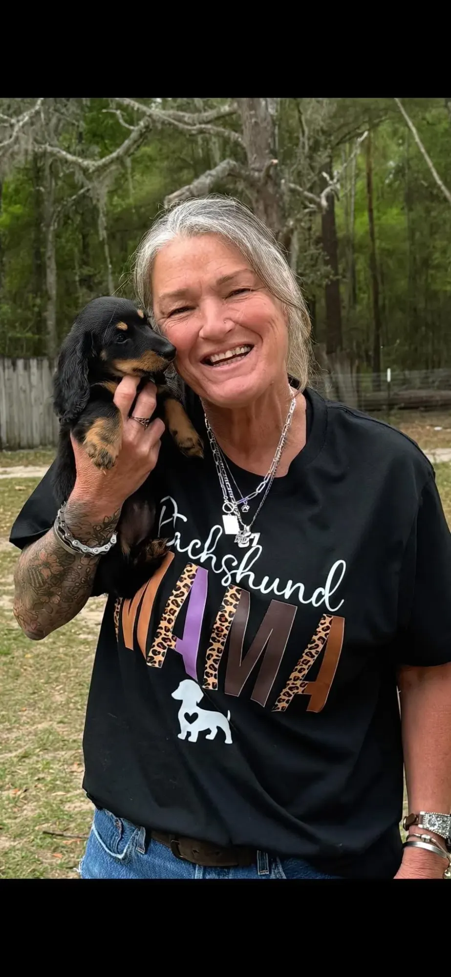A family picking up their Miniature Dachshund puppy at Irish Rose Acres