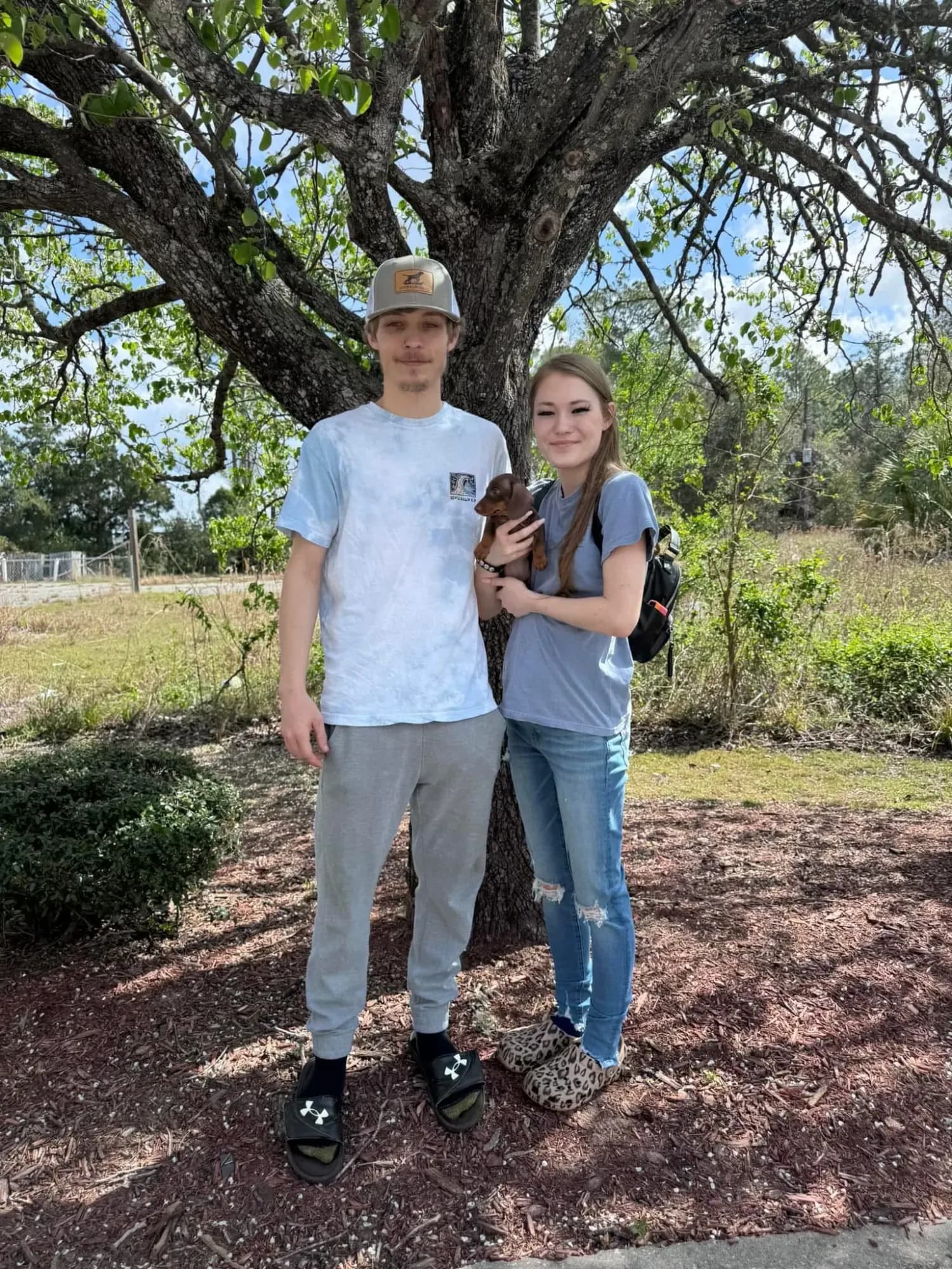 A family picking up their Miniature Dachshund puppy at Irish Rose Acres